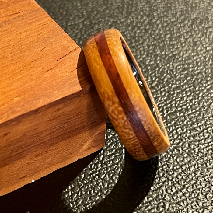 Wooden ring with ceramic core.